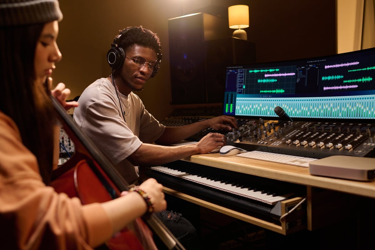 Artists and producers working together in a Neon Beams recording studio
